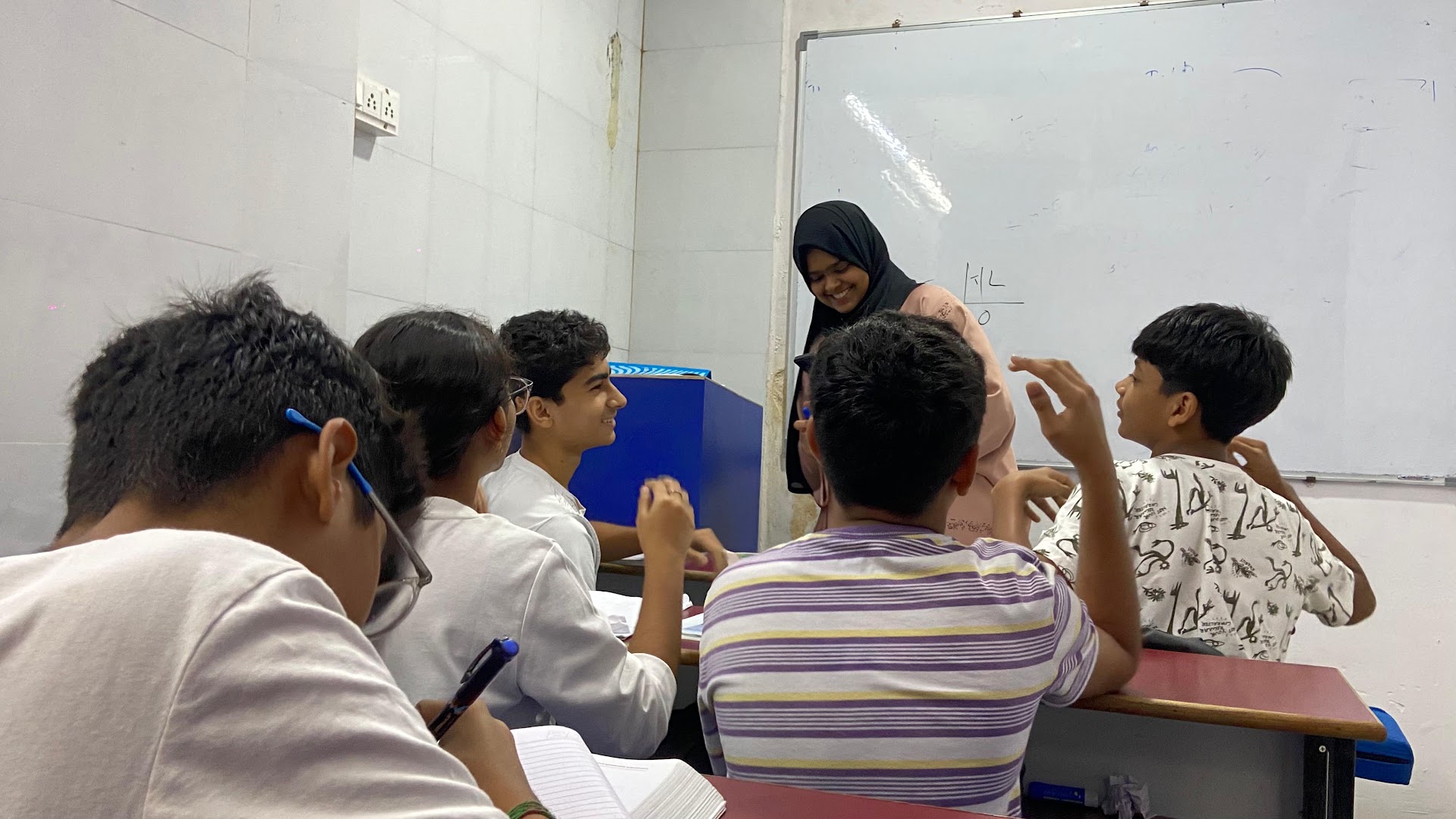 Students learning in a classroom at The Mentor Academy